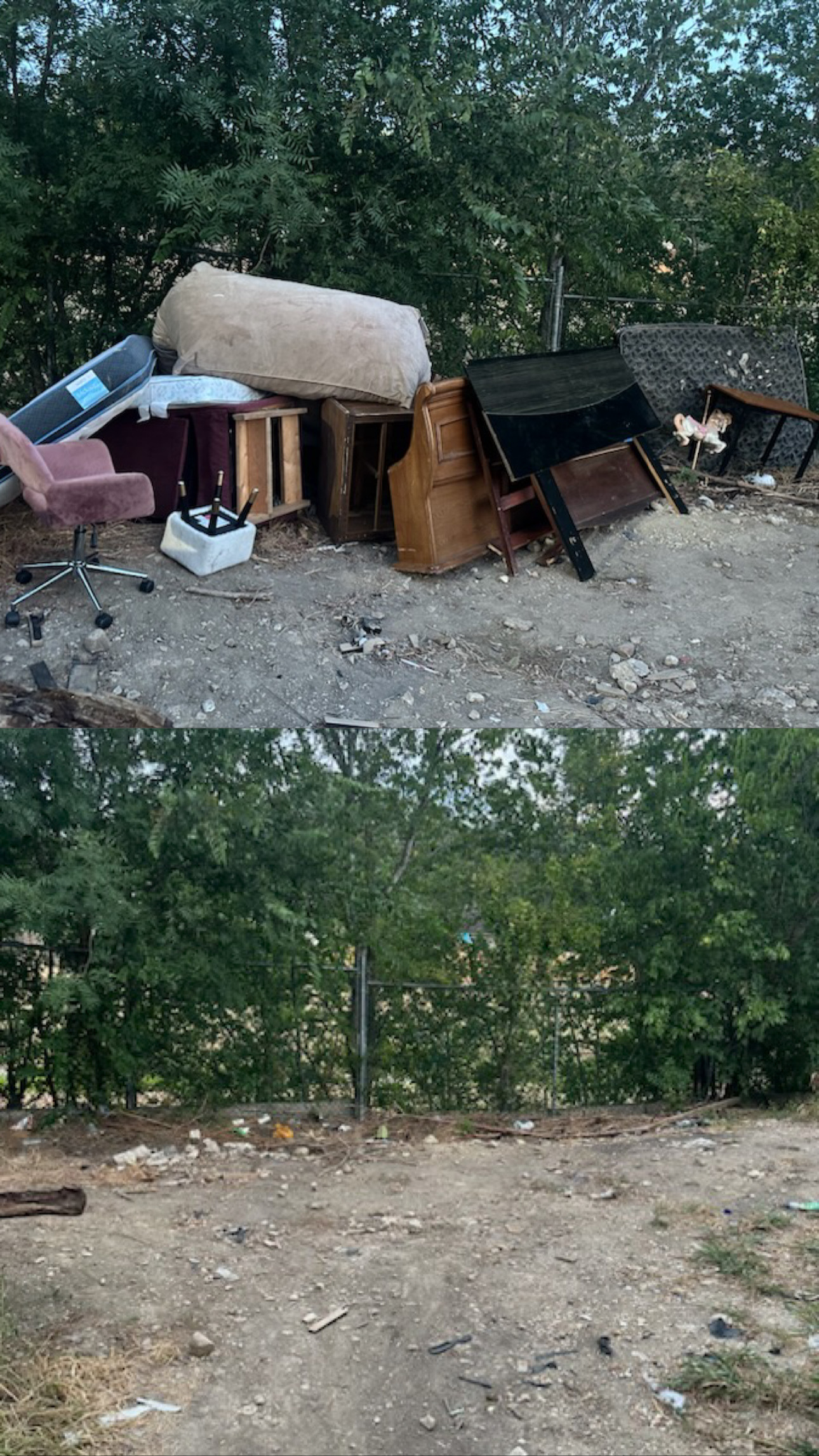 Pile of discarded furniture including chairs, cushions, and tables stacked on dirt ground near a fence with dense green trees in the background.